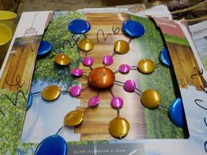 lot 157 image: Kineticc Wind Spinner- slight damag...