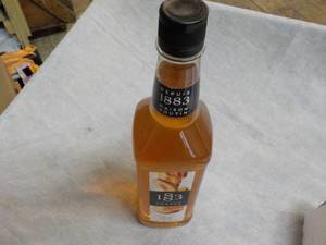 lot 286 image: 33.8oz Bottle 1883 Peach Syrup...