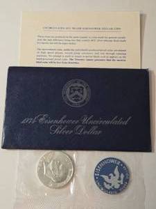 lot 32 image: 1974 Eisenhower Ike Dollar - Blue Label - 40% Silver