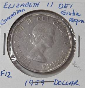 lot 49 image: 1959 Silver Elizabeth II Canadian Dollar-Feature Right- Facing Profile of Queen Elizabeth II-Very Collectible