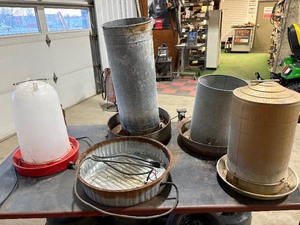 lot 53 image: Chicken Waters and Feeders two heated Plugged in and heated up