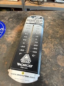 lot 19 image: Metal Monroe Shocks Thermometer