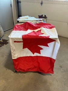 lot 36 image: Canada Flags (2), New Tablecloths (2), Carry Briefcase, SunShields (3)