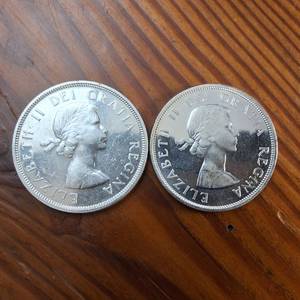 lot 54 image: Lot of 2  1960 and 1961 Silver Canada Dollars  80% silver  Great, bright condition