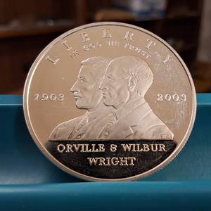 lot 56 image: 2003 Wright Brothers Commemorative Silver Dollar  US Mint  Excellent Condition  90% Silver
