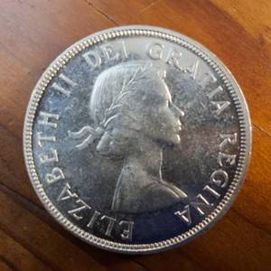 lot 8 image: 1955 Canada Dollar  80% Silver Content  Standard (3 Water Lines) Bright Condition, nice edges
