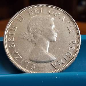 lot 11 image: 1953 Canada Dollar  80% Silver Content  Canada under Elizabeth II  36mm (23.31 grams)
