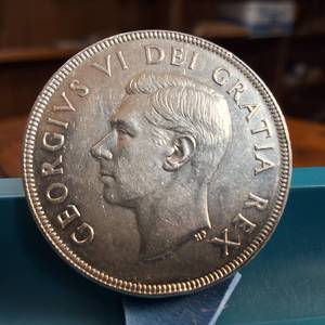 lot 139 image: 1952 Silver Canada Dollar  80% silver  Circulated but nice condition