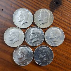 lot 15 image: 7 x Kennedy Half Dollars  40% silver content  nice bright condition  1968D except one is 1966