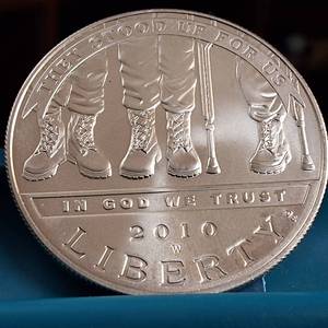 lot 47 image: 2010 �Liberty� West Point US Mint $1 Dollar  Disabled for Life Veterans 90% Silver  26.73 grams