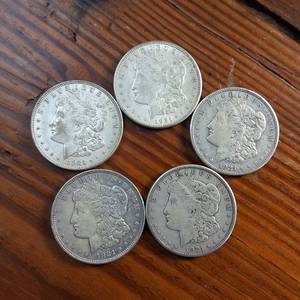 lot 69 image: Lot of 5  1921 Morgan silver dollars  Weight 26.7 grams 90% silver  Popular by the US Mint