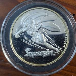lot 92 image: (1987) 1 Troy Ounce .999 Silver Round featuring �Super Girl� AMC Mint Cartoon Celebrity Series