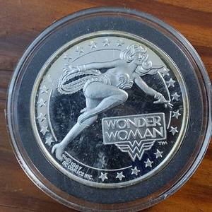 lot 95 image: (1987) 1 Troy Ounce .999 Silver Round �WONDER WOMAN� AMC Mint Cartoon Celebrity Series