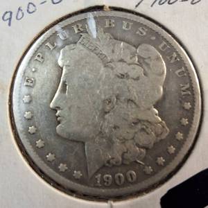 lot 84 image: 1900S Morgan silver dollar  Weight 26.7 grams 90% silver  Most popular by the US Mint