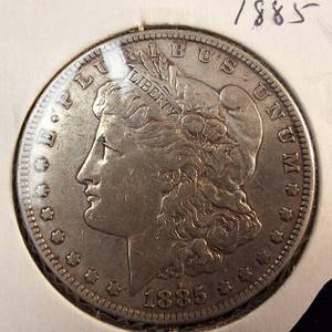 lot 171 image: 1885 Morgan silver dollar  Weight 26.7 grams 90% silver  Most popular collected today