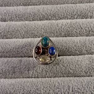 lot 61 image: Large teardrop shaped sterling silver ring with four multicolored cabochon stones. size 8.25 - 9.0g