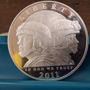 lot 219 image: 2011 U.S. Army Commemorative Silver Dollar  90% silver, diameter of 38.1 mm  26.73 grams