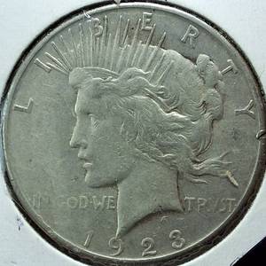 lot 300 image: 1923-S Peace Dollar 90% Silver, 26.73 grams  Circulated 0.77344 troy ounces silver  Nice