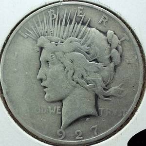 lot 375 image: 1927-D Peace Dollar 90% Silver, 26.73 grams  Circulated condition 0.77344 troy ounces silver