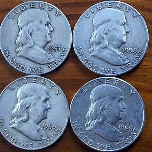 lot 402 image: Lot of 4 1957, 58,59,60 Franklin Half Dollars  90% silver  .36 oz silver each  $2 Dollar Face