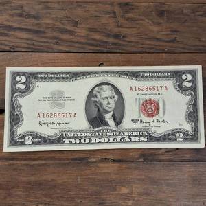 lot 358 image: 1963A $2 Red Seal United States Note � Fine but circulated - Jefferson  note, pencil make on reverse