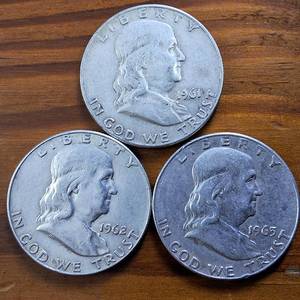 lot 330 image: Lot of 3 series 1961-1963 Franklin Half Dollars  90% silver,  $1.5 Face Value 3 circulated coins