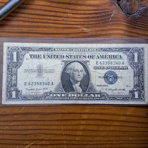 lot 307 image: Series 1957A $1 Silver Certificate in circulated condition  Blue Seal