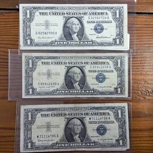 lot 328 image: Lot of 3 Silver Certificates  Series 1957 1957A 1957B  Blue Seals  One Crisp, one high #