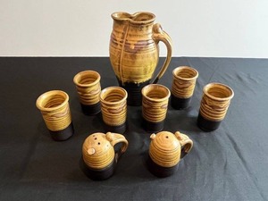 lot 24 image: Stoneware Amber-Glazed Pitcher Set with Cups & Matching Salt & Pepper