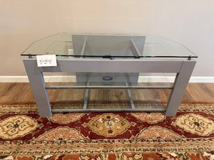 lot 64 image: Glass Top Console Table - 24 in H x 48 in W x 20 in D - Powder-Coated Steel Frame - rug not inc