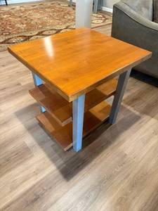 lot 71 image: End Table - Wood Top, Blue Steel Legs, 3-Shelf Open Storage, 26H x 25W x 27D in