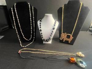 lot 105 image: Assorted Necklaces - Black Onyx Like Bead, Gold Elephant Pendant, Green Donut Pendant