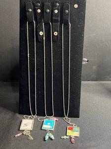 lot 118 image: Three Hand Made Art Glass Framed Tile Pendant Necklaces - Assorted Floral & Teacup Prints (Lot of 3)