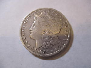 lot 59 image: 1886 MORGAN SILVER DOLLAR COIN