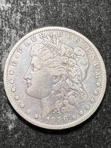 lot 59 image: 1886-O US MORGAN SILVER DOLLAR