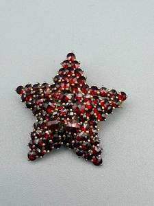 lot 154 image: Star-Shaped Brooch Pin - Gold-Tone With Red Faceted Stones