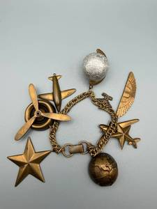 lot 166 image: Travel Aviation Charm Bracelet Bronze-Tone With Planes, Stars, Wings & Globe