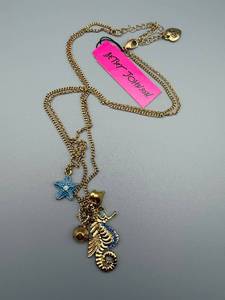 lot 183 image: Betsey Johnson Seahorse Necklace - Blue Star Charm & Starfish Accent