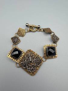 lot 219 image: Gold-Tone Bracelet with Black Cabochon Squares & Silver Filigree Center