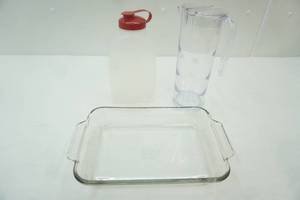 lot 67 image: Anchor Hocking Baking Dish, Tupperware Juice Container, Water Pitcher 11 tall by 4