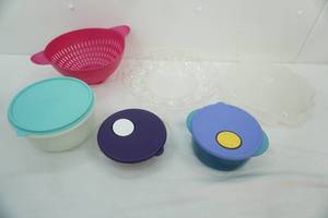 lot 74 image: Tupperware Food Storage Containers wlids, strainer, deviled egg container