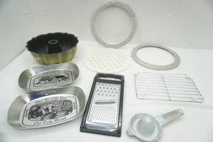 lot 163 image: Bundt Pan, Cooling Rack, Give Us Our Daily Bread Tin Dish, vintage juicer, grater