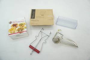 lot 257 image: Butter Dish, Pampered Chef Decorator Bottle Set, Vintage Grater, Tortilla Bakers, vintage canning jar lifter-gripper