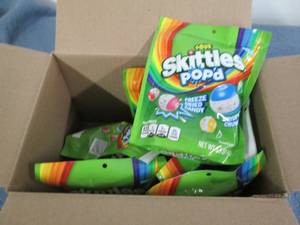 lot 32 image: 8 5.5oz bags of Skittles popped fre...