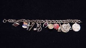 lot 6 image: Sterling Charm Bracelet with 13 Charms