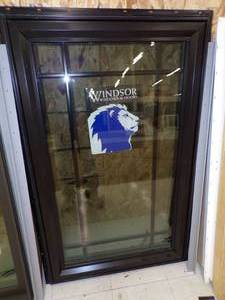 lot 29 image: Black Crank out Window With Maroon Frame