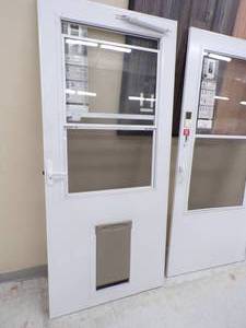 lot 56 image: 36 White Storm Door with Sceen and Pet Door