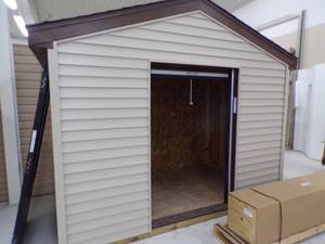 lot 58 image: Vinyl Siding Building Display With Roll Down Door - 3 Sides