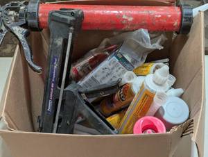 Box full of Adhesive and Caulk Guns