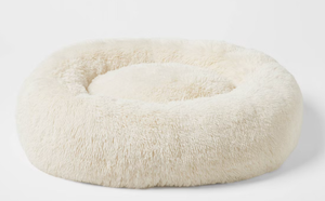 lot 50 image: Boots & Barkley Donut Bolster Dog Bed - Cream - L - 36 Inches (L), 8 Inches (H) x 29 Inches (W) (Slightly Dirty From Transit, Can Be Washed)